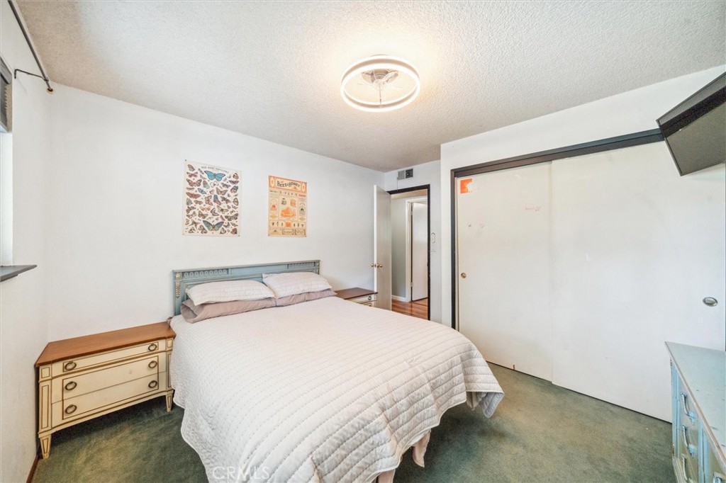 6791 Whispering Canyon Drive Anderson, CA 96007 - Photo 20 of 51 a bedroom with a bed and a dresser