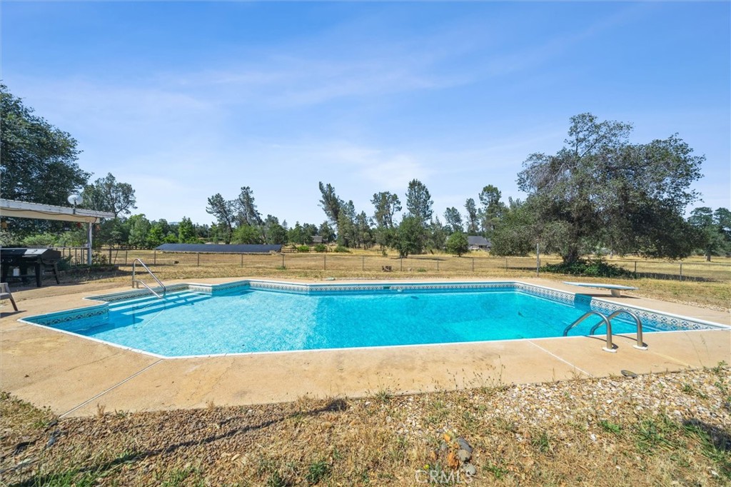 6791 Whispering Canyon Drive Anderson, CA 96007 - Photo 30 of 51 a view of a swimming pool and an outdoor space