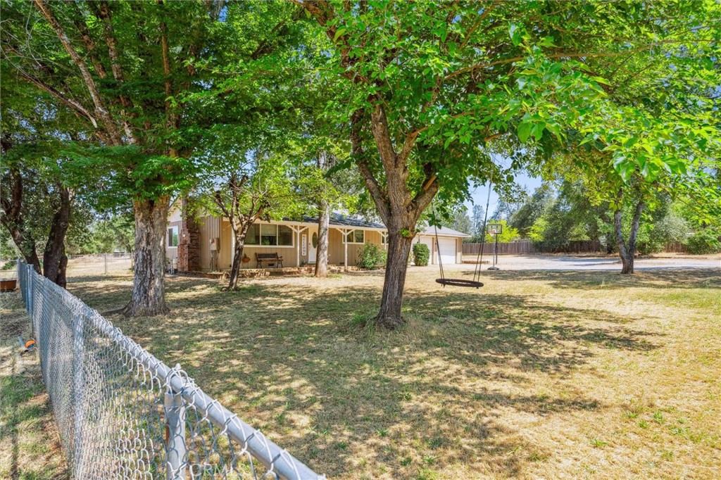 6791 Whispering Canyon Drive Anderson, CA 96007 - Photo 31 of 51 a view of a trees in a yard