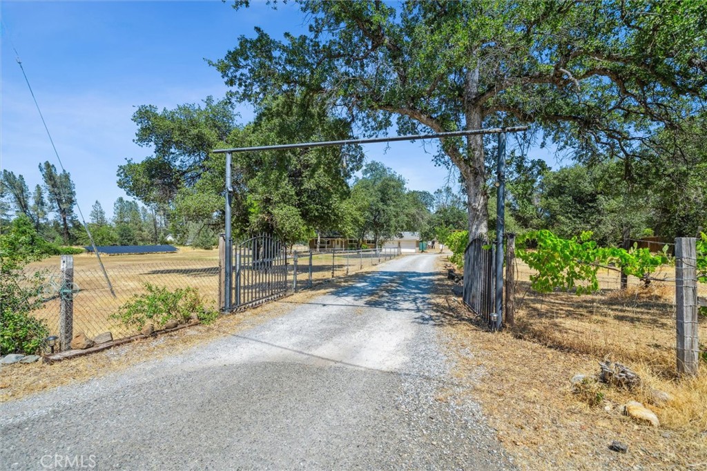 6791 Whispering Canyon Drive Anderson, CA 96007 - Photo 35 of 51 a view of a yard and basketball court