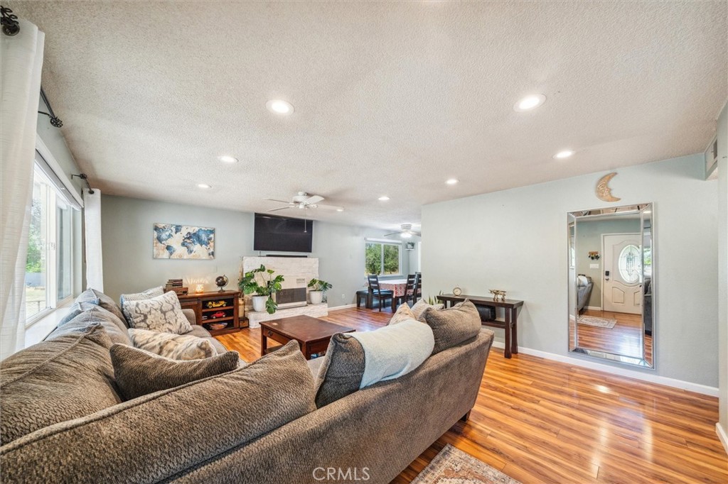 6791 Whispering Canyon Drive Anderson, CA 96007 - Photo 4 of 51 a living room with furniture kitchen view and a window