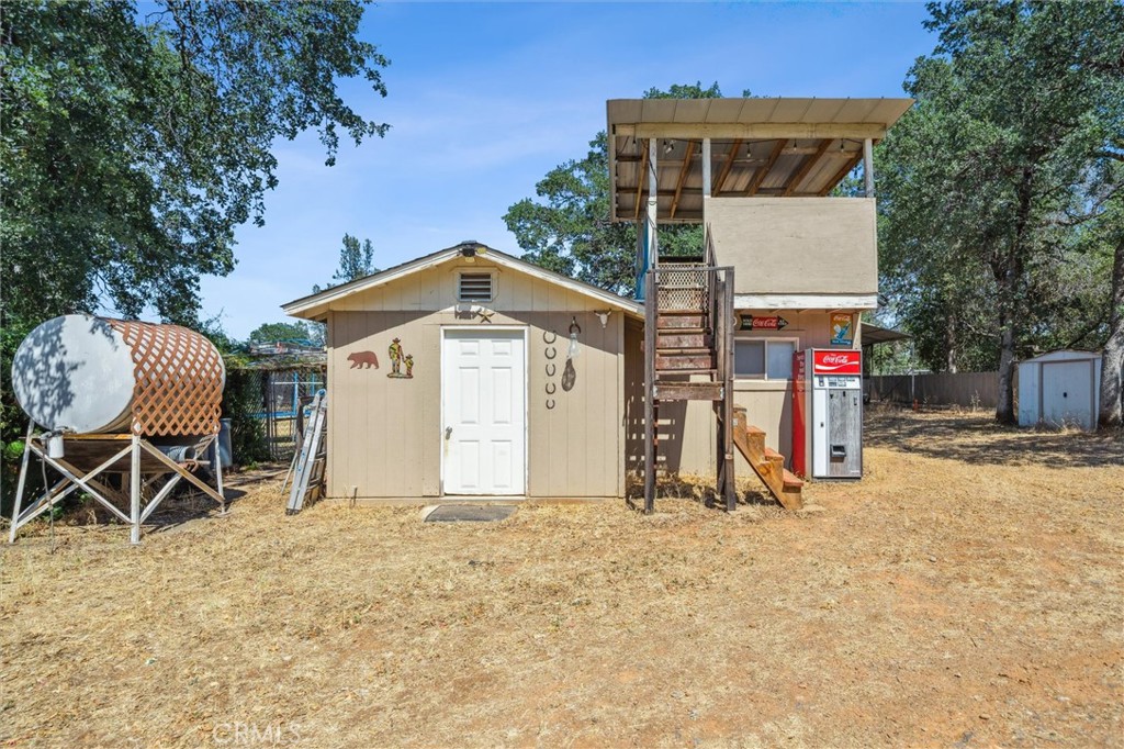 6791 Whispering Canyon Drive Anderson, CA 96007 - Photo 41 of 51 a view of a house with wooden fence