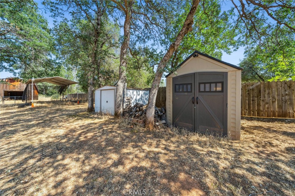 6791 Whispering Canyon Drive Anderson, CA 96007 - Photo 42 of 51 a view of a house with a yard