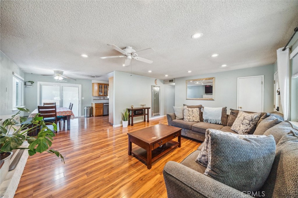 6791 Whispering Canyon Drive Anderson, CA 96007 - Photo 5 of 51 a living room with furniture and wooden floor