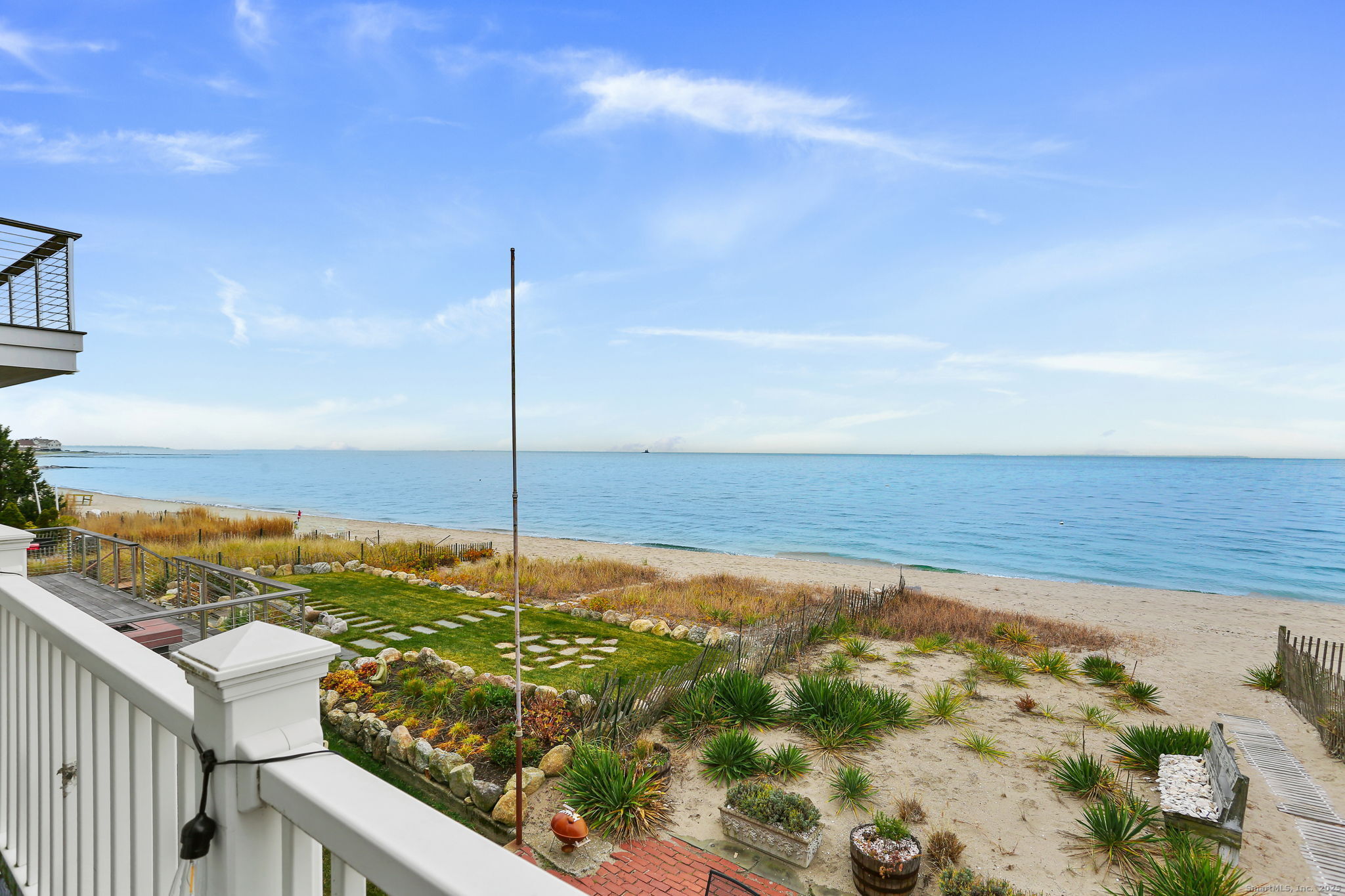 1235 Fairfield Beach Road Fairfield, CT 06824 - Photo 19 of 39 a view of an ocean from a balcony