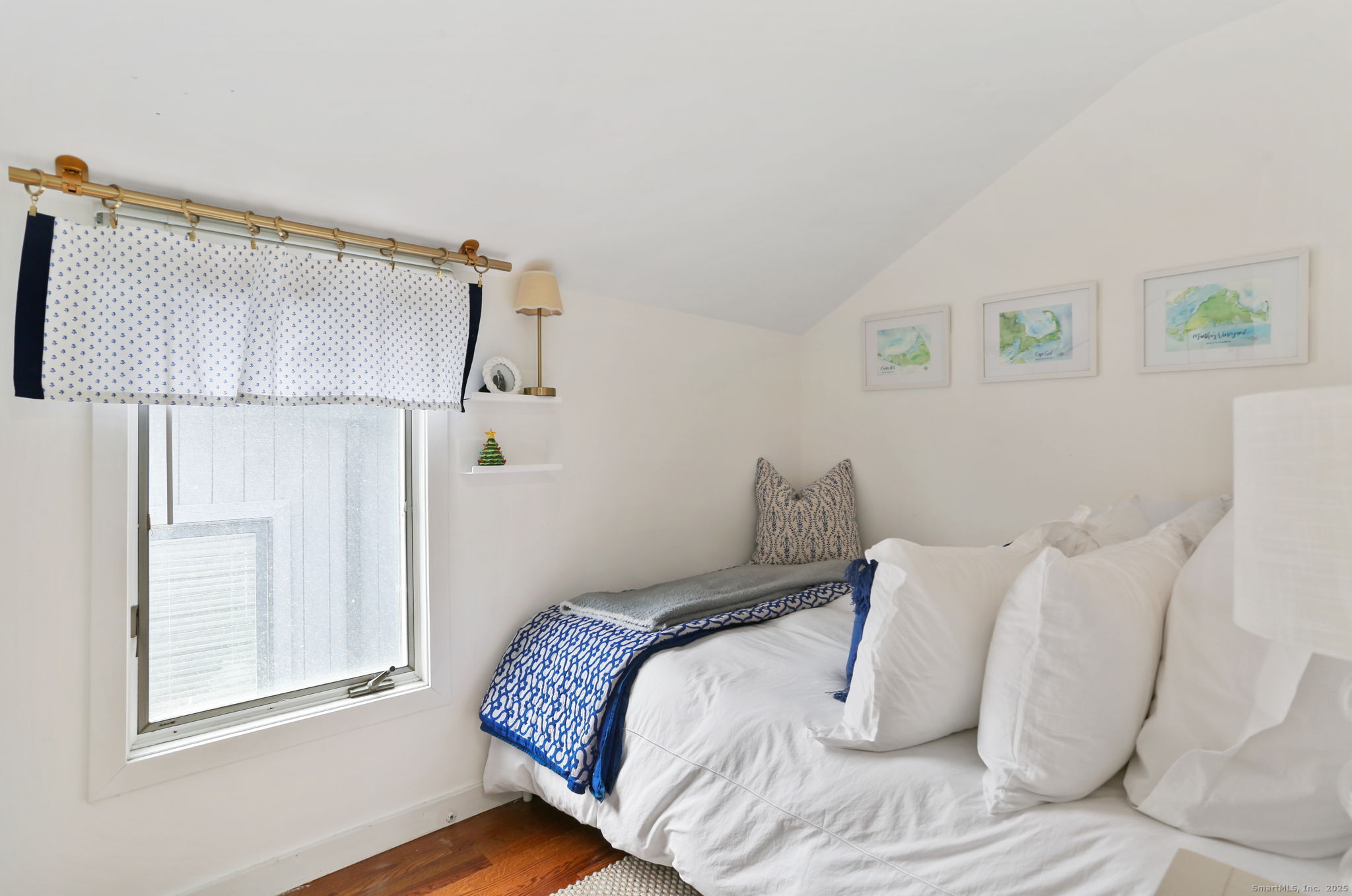 1235 Fairfield Beach Road Fairfield, CT 06824 - Photo 20 of 39 a bedroom with a bed and a window