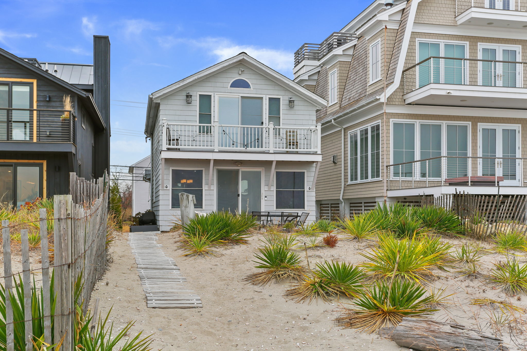1235 Fairfield Beach Road Fairfield, CT 06824 - Photo 22 of 39 a front view of a house with a garden