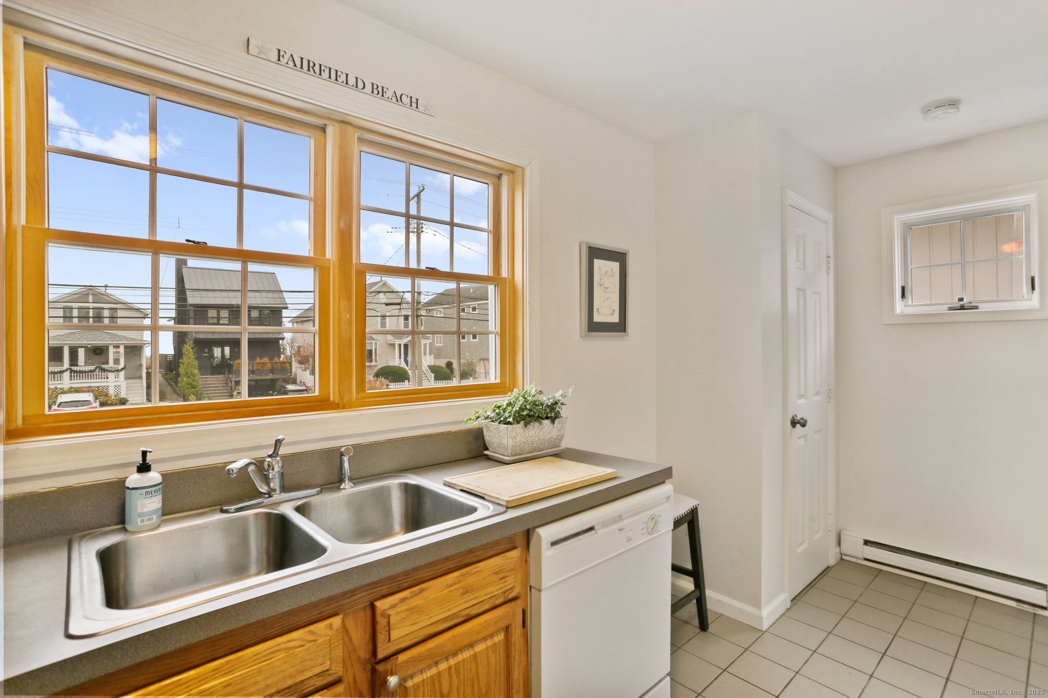 1235 Fairfield Beach Road Fairfield, CT 06824 - Photo 33 of 39 a kitchen with a sink and wide window