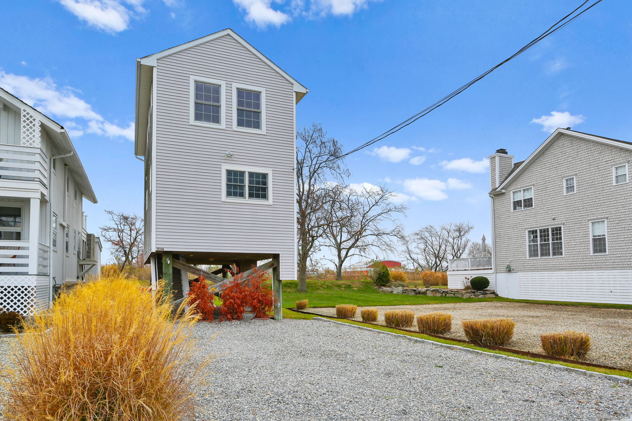 1235 Fairfield Beach Road Fairfield, CT 06824 - Photo 37 of 39 a view of a house with pool and a yard