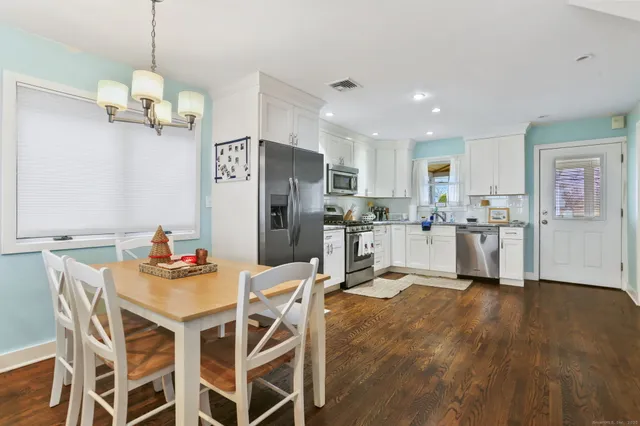 a view of a hallway with washer and dryer