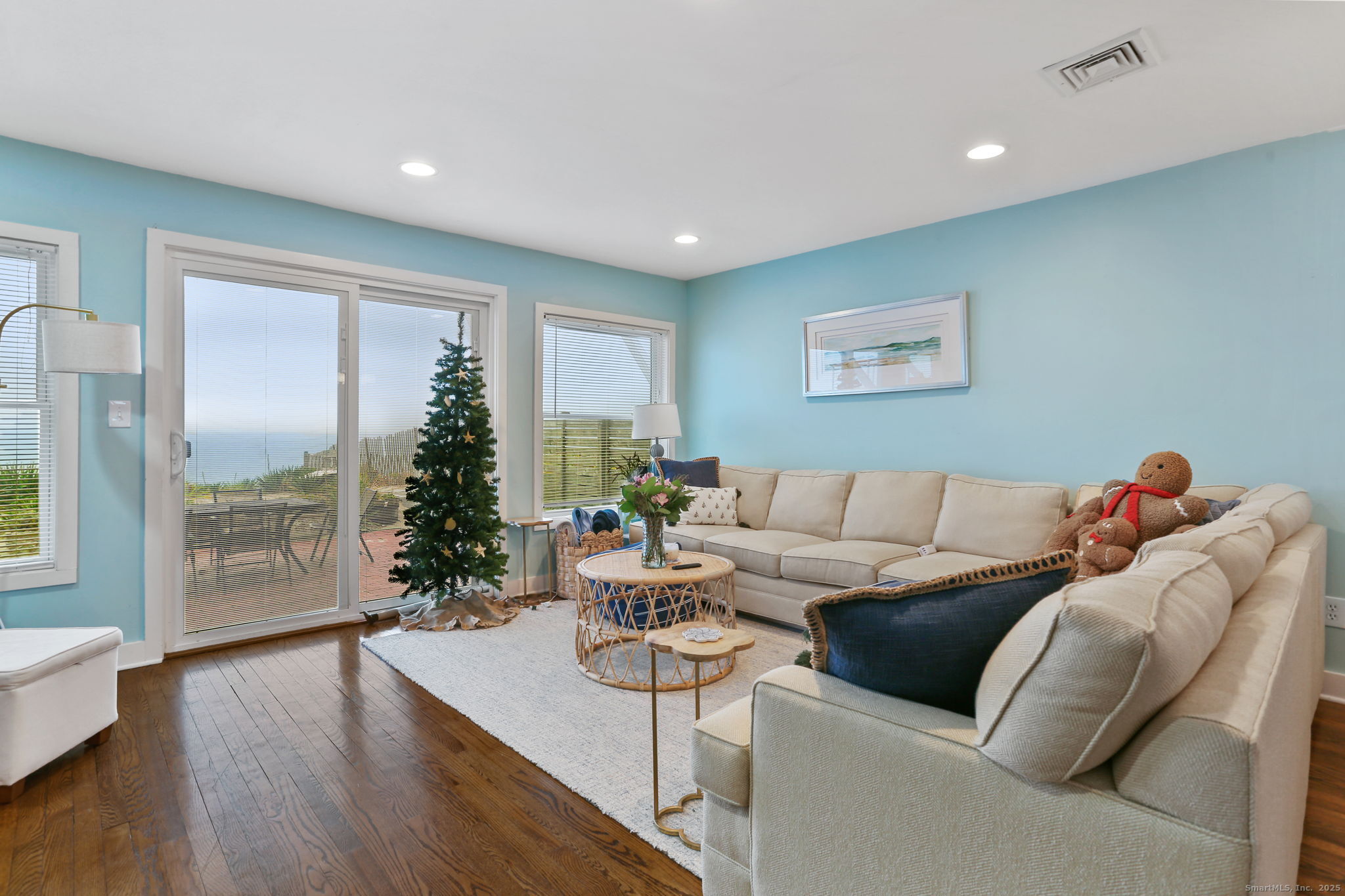 1235 Fairfield Beach Road Fairfield, CT 06824 - Photo 10 of 39 a living room with furniture and a large window