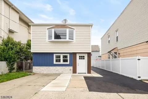 a view of a house with a street