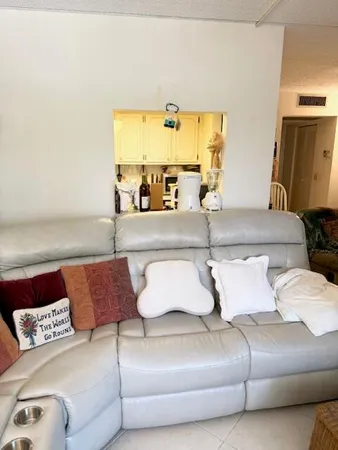 a view of a room with furniture and lounge chair