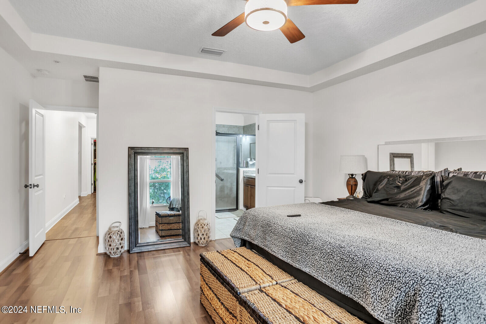 4190 Quiet Crk Loop Middleburg, FL 32068 - Photo 16 of 22 a bedroom with bed and wooden floor