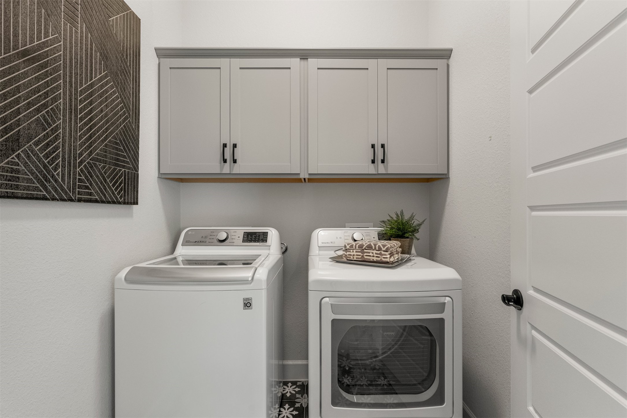 4313 Vaughan Street Austin, TX 78723 - Photo 31 of 39 Spacious laundry room with built-in cabinetry for additional storage