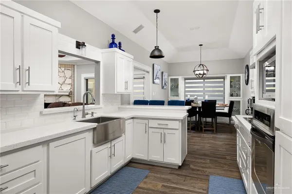 a kitchen with lots of counter space and a sink