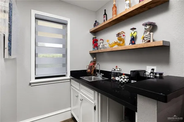 a kitchen with a sink and cabinets