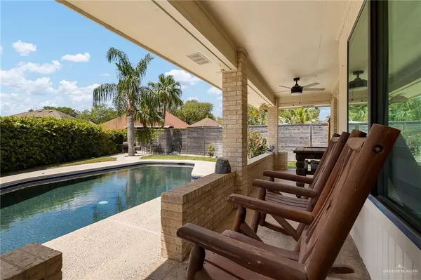 a view of swimming pool with outdoor seating