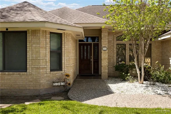 a view of house with yard