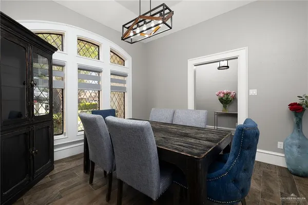 a view of a dining room with furniture and wooden floor