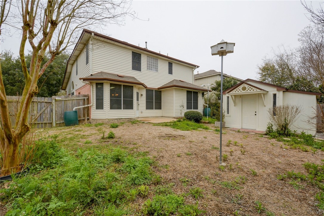 3504 Texas Topaz Drive Austin, TX 78728 - Photo 25 of 29 a front view of a house with a yard and garage