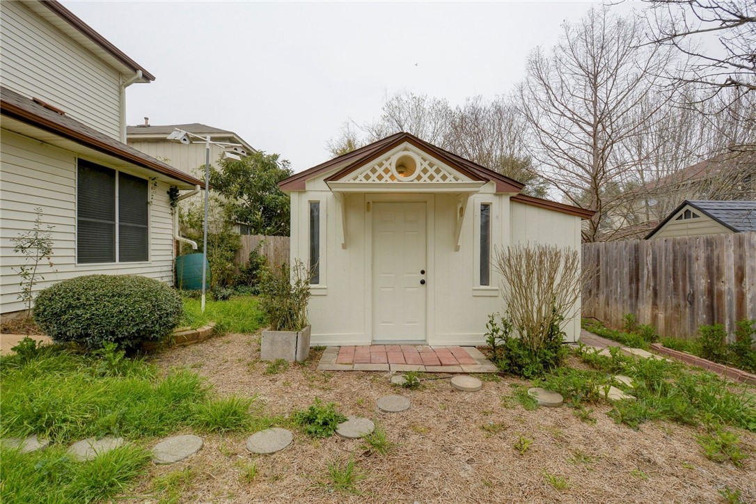 3504 Texas Topaz Drive Austin, TX 78728 - Photo 28 of 29 a front view of a house with garden