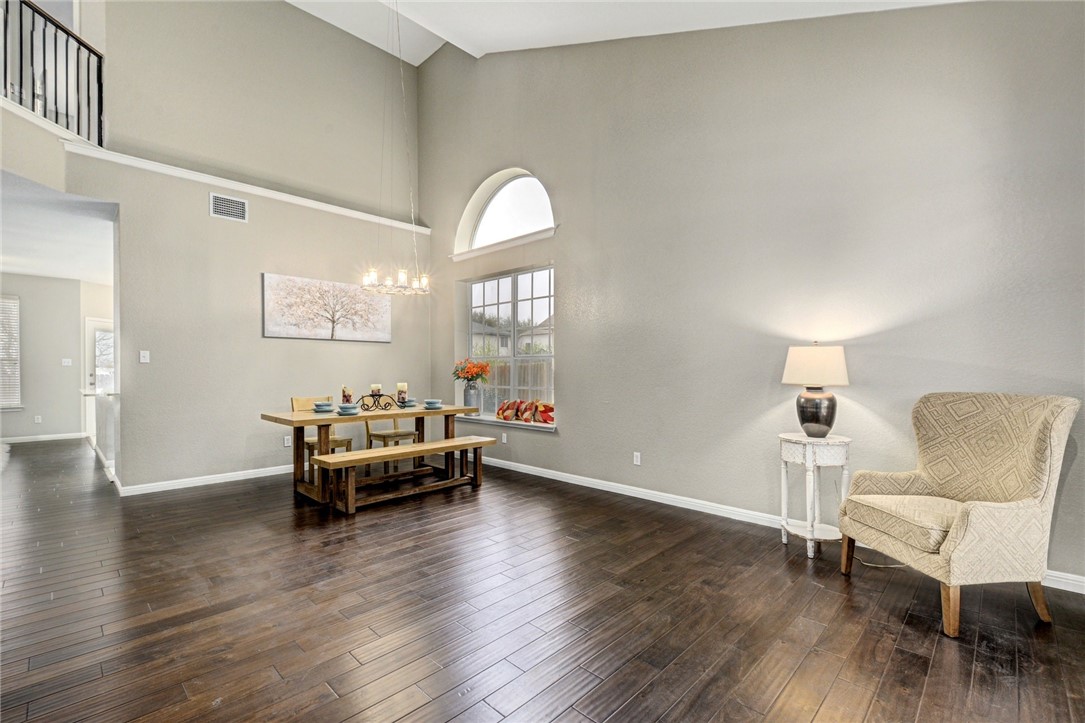 3504 Texas Topaz Drive Austin, TX 78728 - Photo 4 of 29 a living room with furniture and a wooden floor