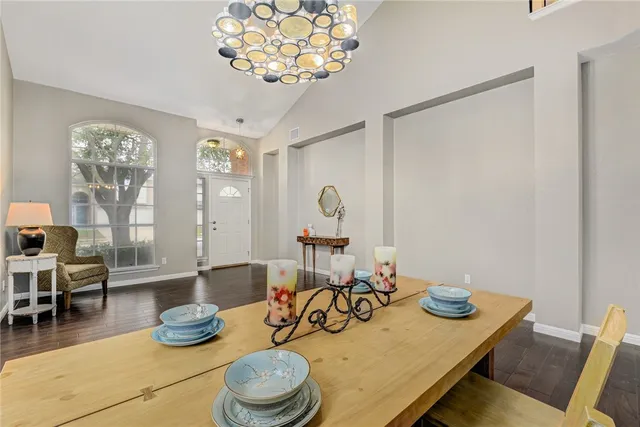 a kitchen with a table and chairs
