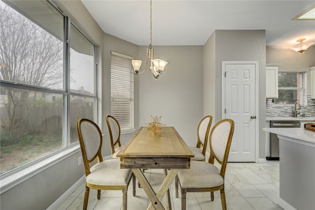 3504 Texas Topaz Drive Austin, TX 78728 - Photo 9 of 29 a dining room with furniture and window