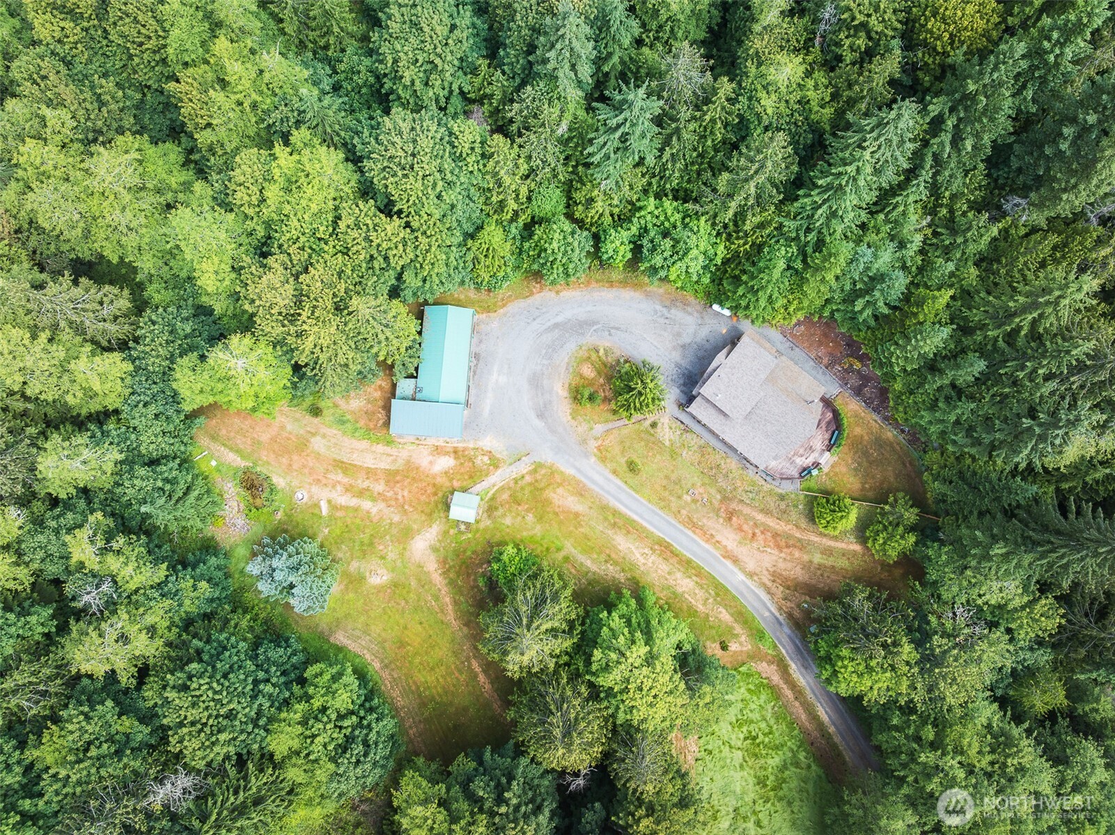 1422 Grauel-Ramapo Road Port Angeles, WA 98363 - Photo 37 of 40 an aerial view of a house with a yard