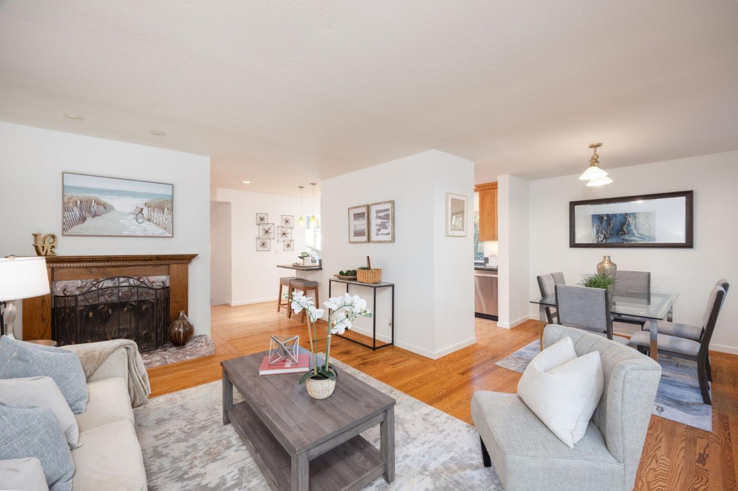 1204 Rainier Avenue Pacifica, CA 94044 - Photo 12 of 38 a living room with furniture and a fireplace