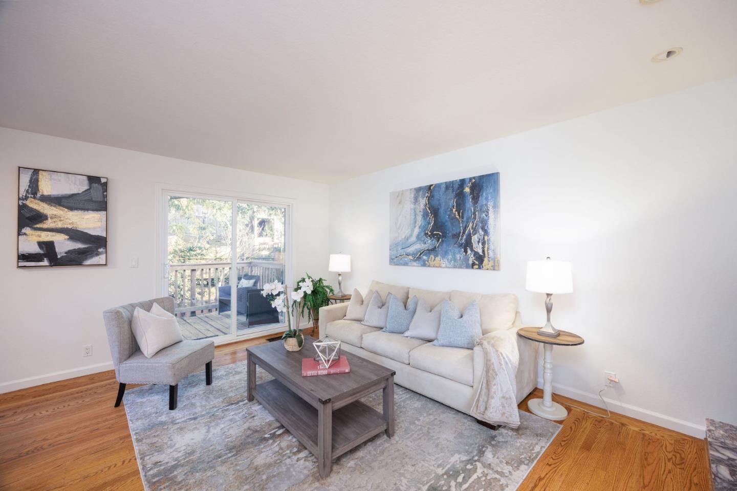 1204 Rainier Avenue Pacifica, CA 94044 - Photo 15 of 38 a living room with furniture and a painting on the wall