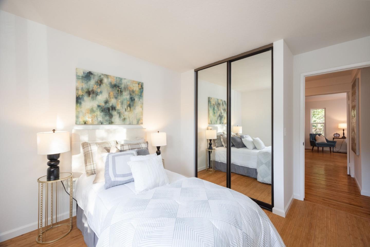 1204 Rainier Avenue Pacifica, CA 94044 - Photo 18 of 38 a bedroom with a bed and a mirror