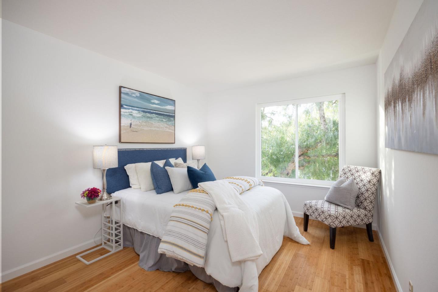 1204 Rainier Avenue Pacifica, CA 94044 - Photo 21 of 38 a bedroom with a bed and wooden floor