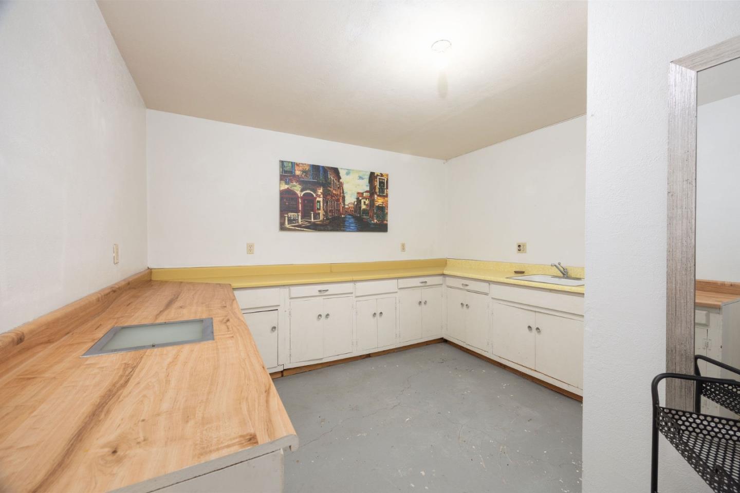 1204 Rainier Avenue Pacifica, CA 94044 - Photo 29 of 38 a view of cabinets with wooden floor