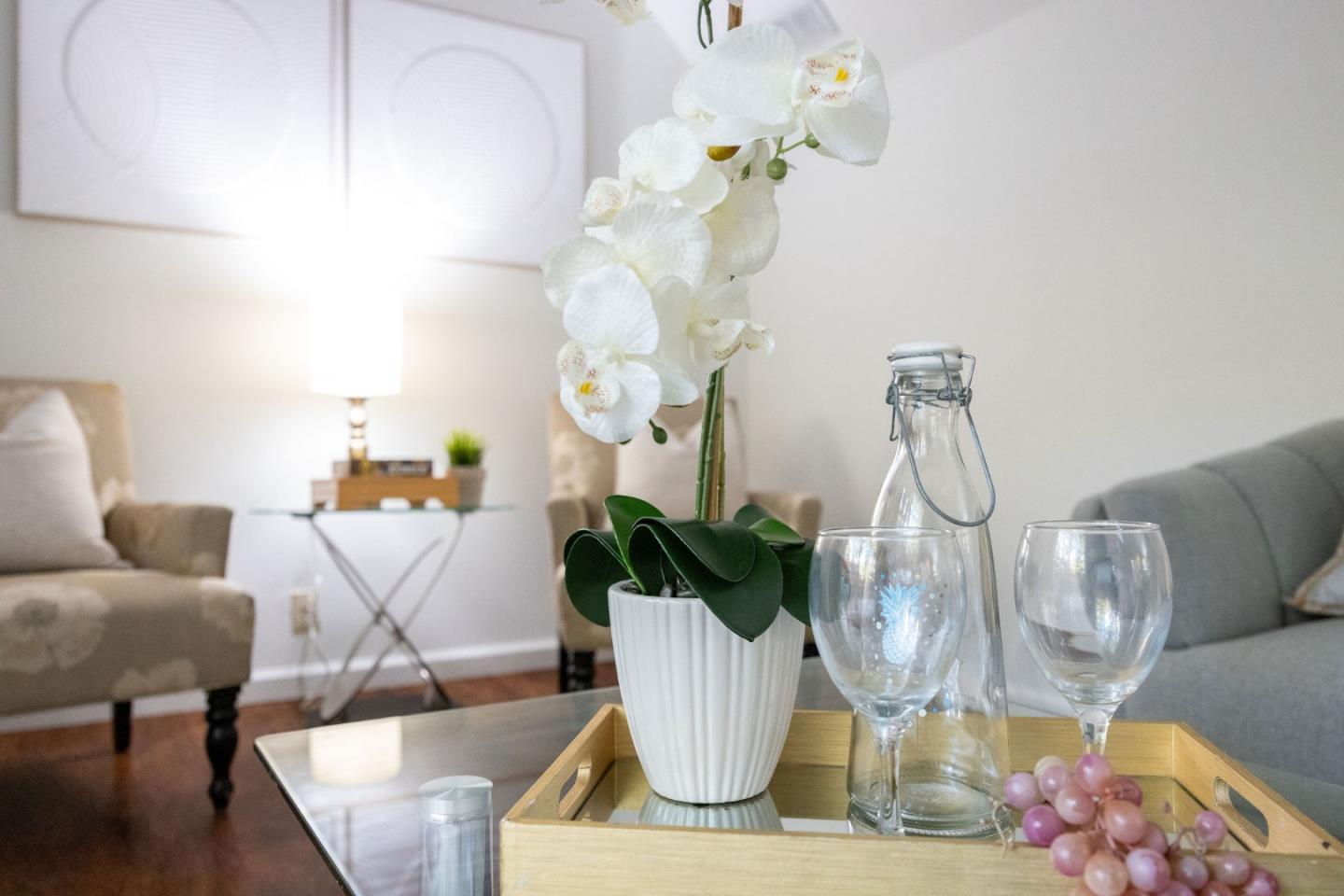 1204 Rainier Avenue Pacifica, CA 94044 - Photo 33 of 38 a living room with furniture and a chandelier