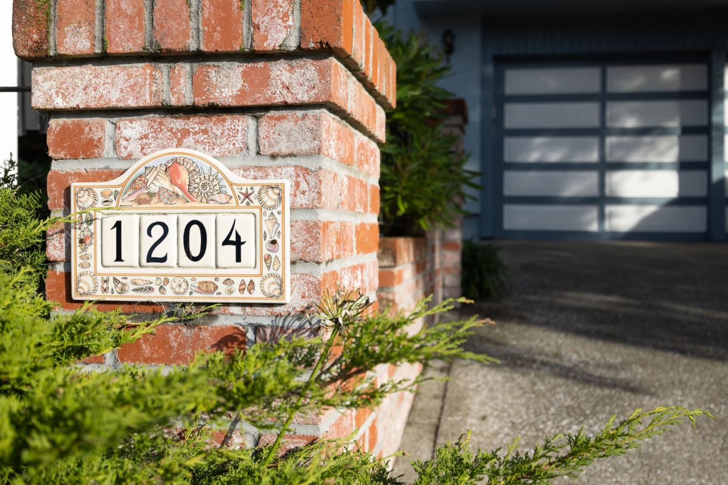1204 Rainier Avenue Pacifica, CA 94044 - Photo 4 of 38 a sign on the side of a building