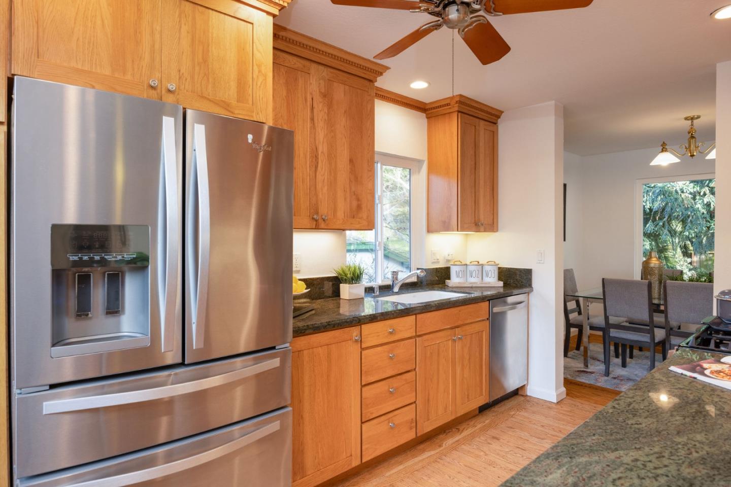 1204 Rainier Avenue Pacifica, CA 94044 - Photo 6 of 38 a kitchen with stainless steel appliances granite countertop a refrigerator and a stove