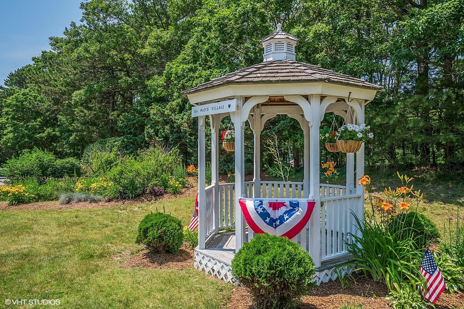 67 Round House Road Bourne, MA 02532 - Photo 15 of 15 a front view of a house with garden