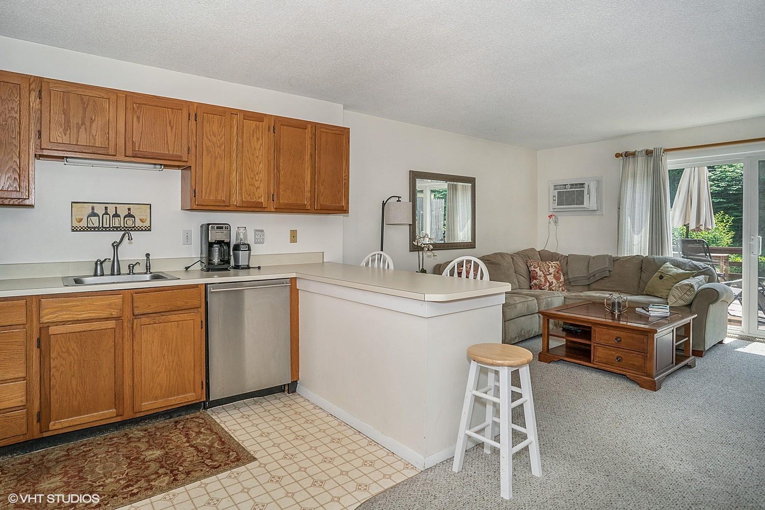 67 Round House Road Bourne, MA 02532 - Photo 7 of 15 a kitchen with a sink stove and cabinets