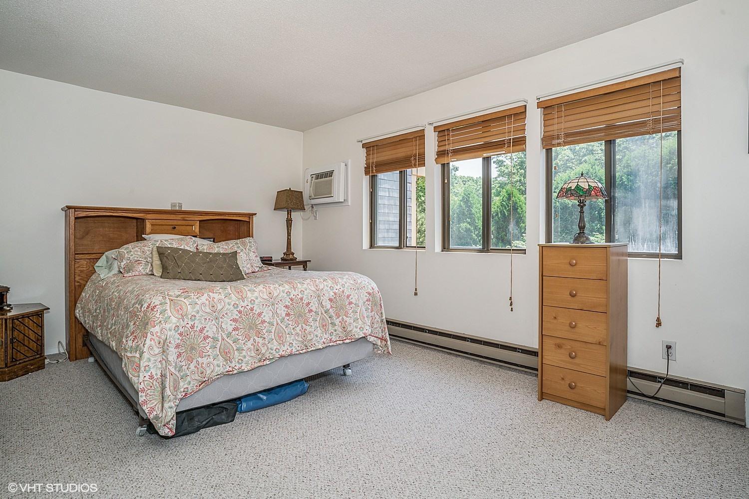 67 Round House Road Bourne, MA 02532 - Photo 8 of 15 a bed room with a bed and a window
