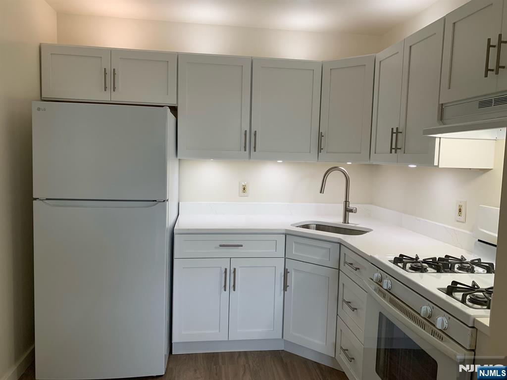 635 B Ridge Road, Unit B Lyndhurst, NJ 07071 - Photo 13 of 16 a kitchen with a sink stove and refrigerator
