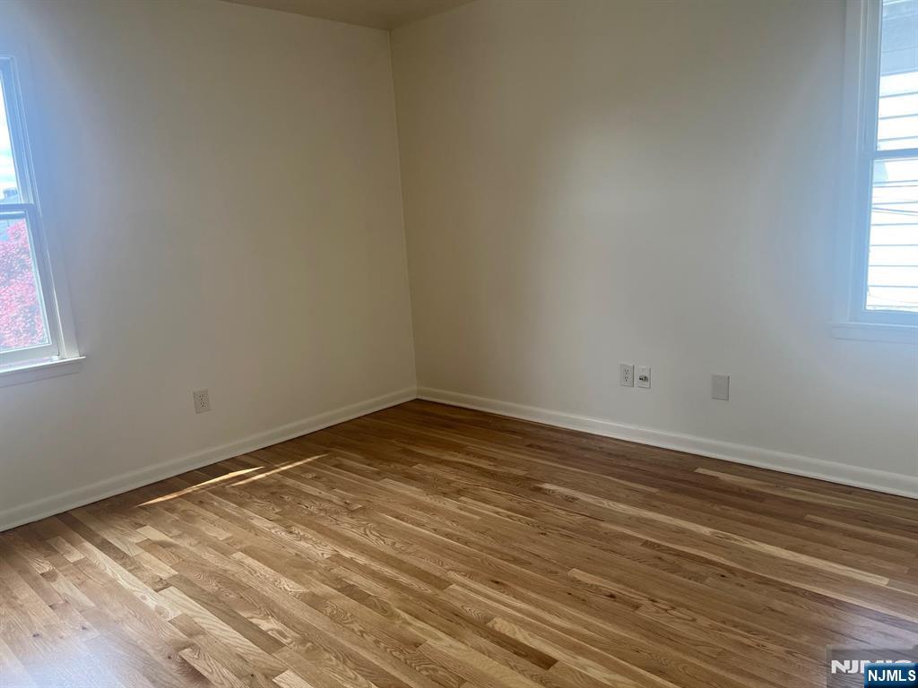 635 B Ridge Road, Unit B Lyndhurst, NJ 07071 - Photo 6 of 16 a view of empty room with wooden floor and fan