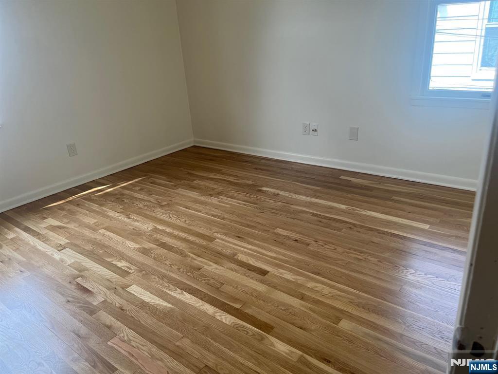635 B Ridge Road, Unit B Lyndhurst, NJ 07071 - Photo 7 of 16 a view of empty room with wooden floor