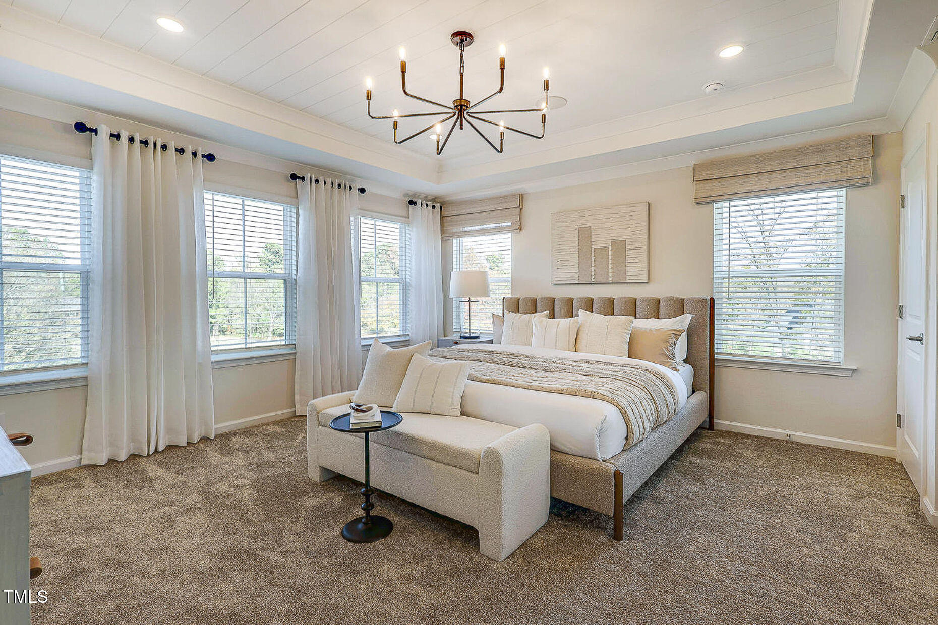 1416 Chrysalis Place Apex, NC 27502 - Photo 5 of 10 a bed room with a bed and a chandelier