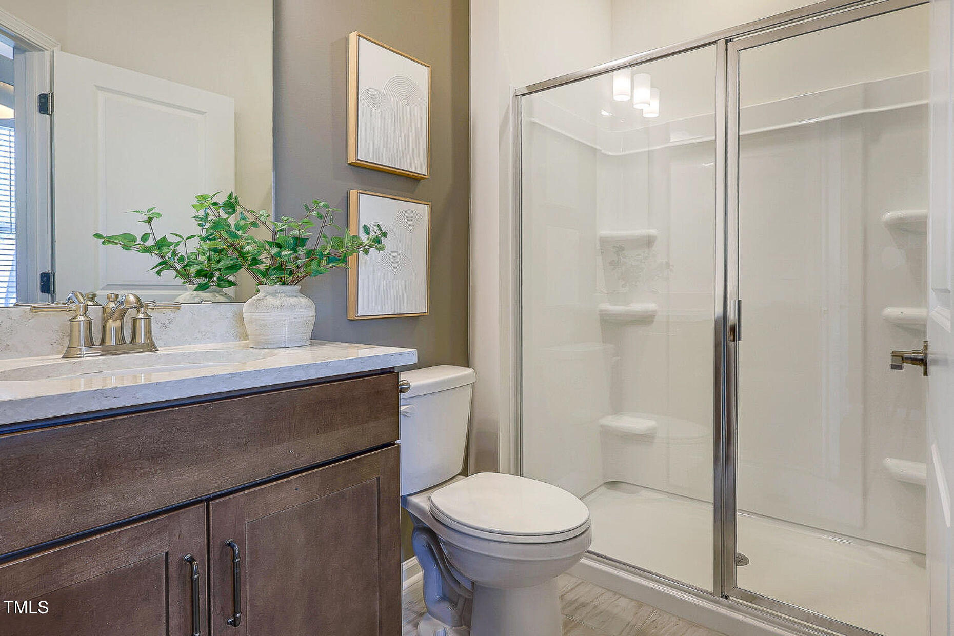 1416 Chrysalis Place Apex, NC 27502 - Photo 6 of 10 a bathroom with a sink a toilet and shower