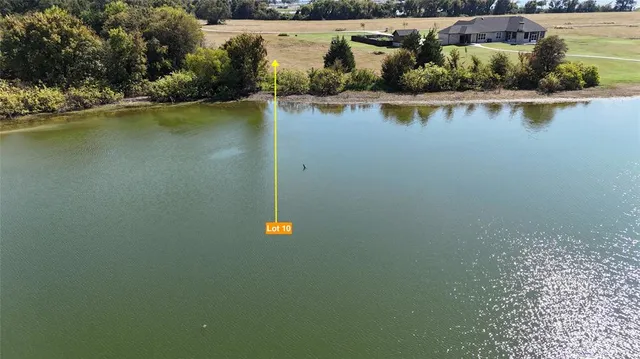 a view of an ocean with a mountain view