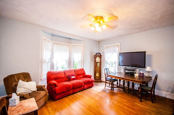 257 Market Street Boston, MA 02135 - Photo 14 of 16 a living room with furniture and a flat screen tv