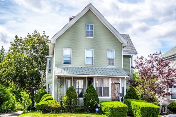 257 Market Street Boston, MA 02135 - Photo 2 of 16 a front view of a house with plants and garden