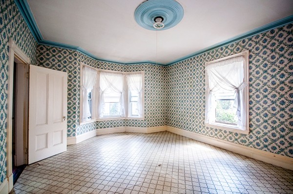 257 Market Street Boston, MA 02135 - Photo 7 of 16 an empty room with wooden floor and windows
